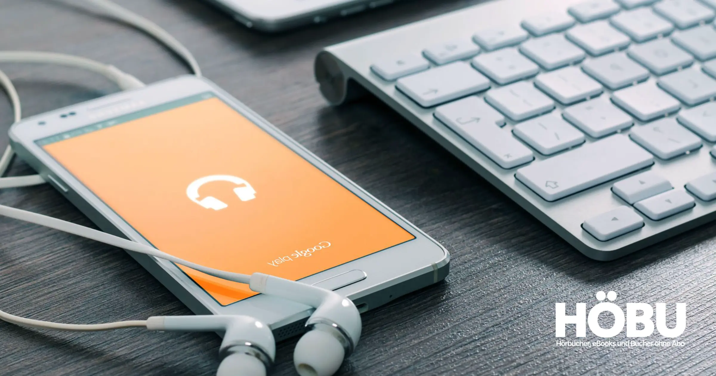 Handy oder MP3-Player und Computer nebeneinander
